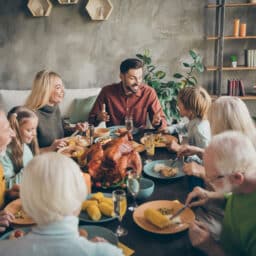 Cheerful large family enjoying a holiday meal together.